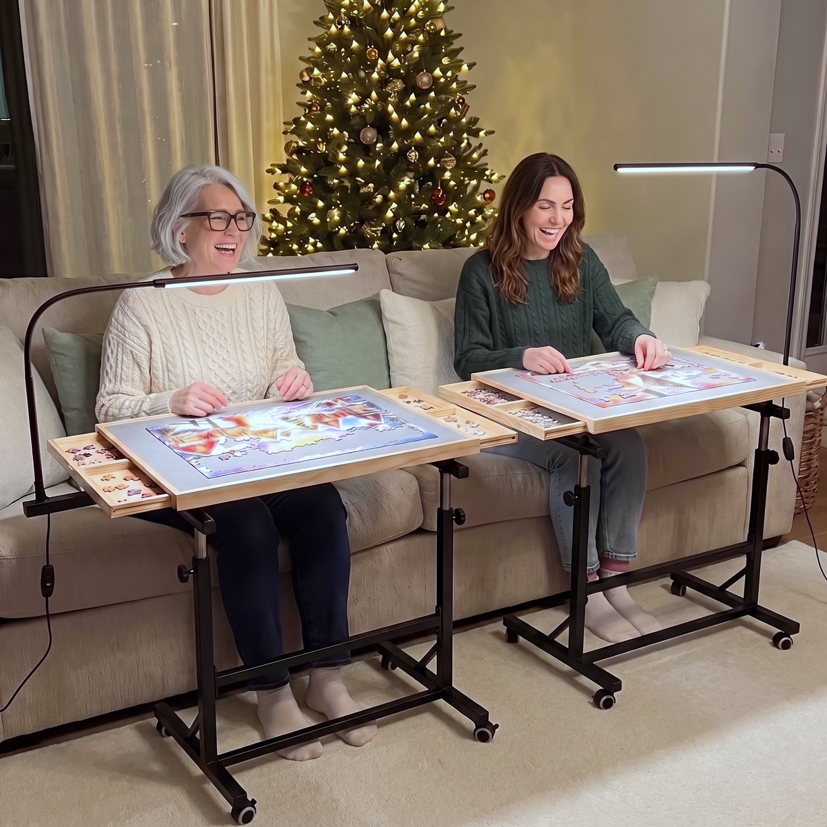 Two women puzzling side by side on PuzzleNest rolling puzzle tables